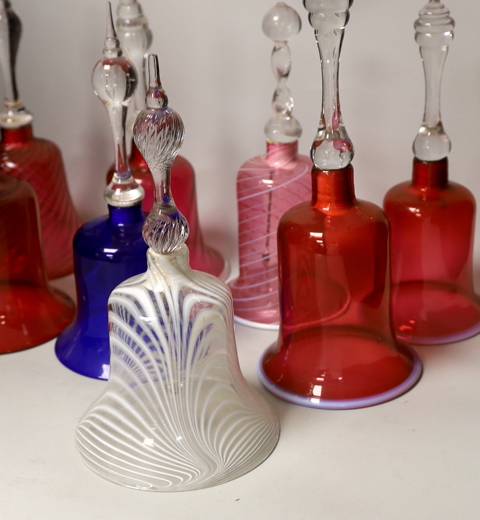 Eight Victorian coloured glass hand bells, tallest 34cm